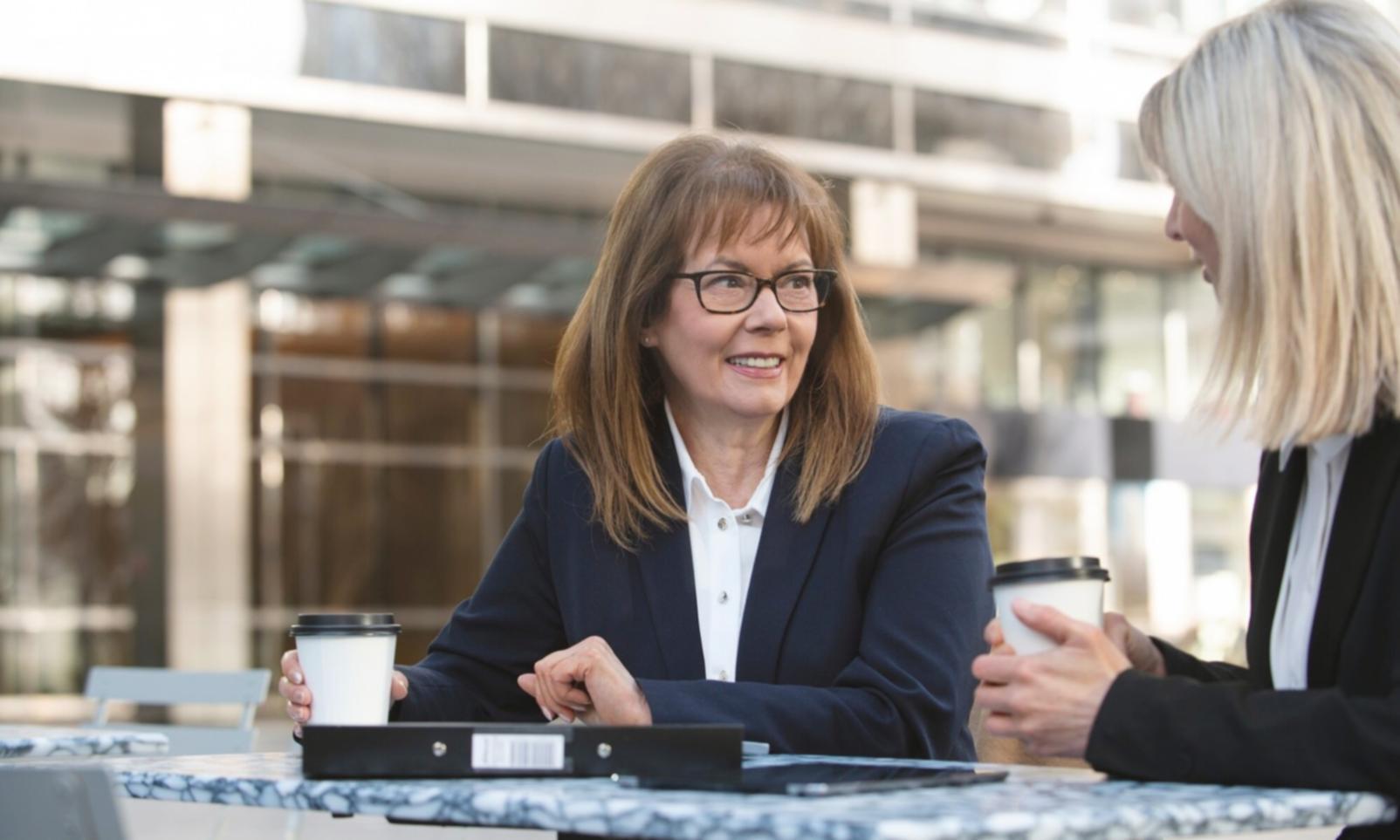 Students working through financial analysis case studies in collaborative environment