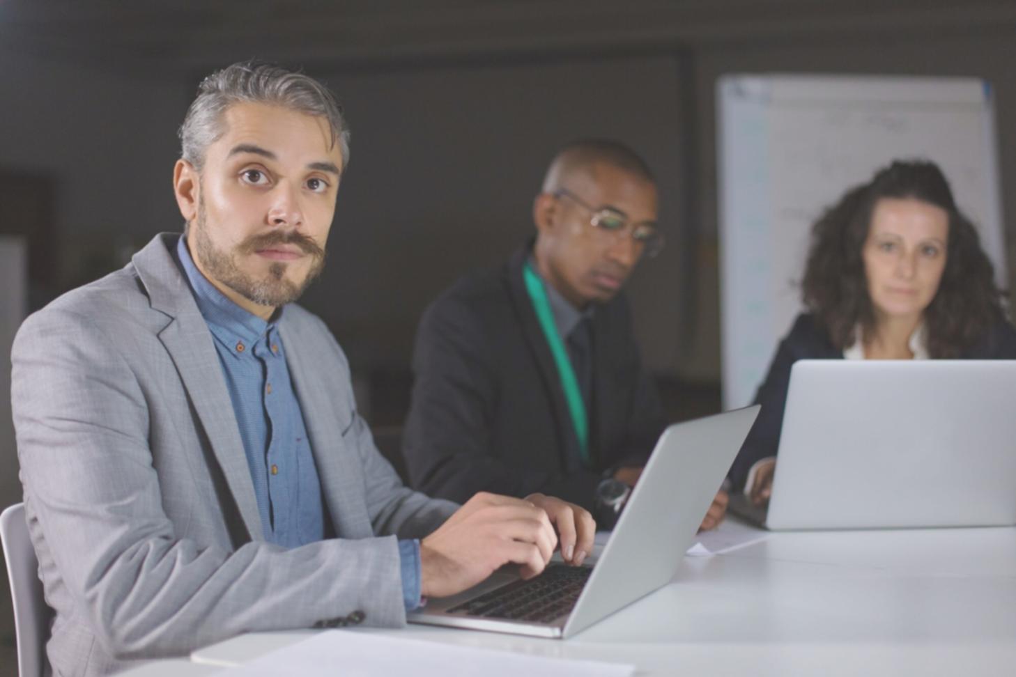 Professional analysing financial documents with charts and data