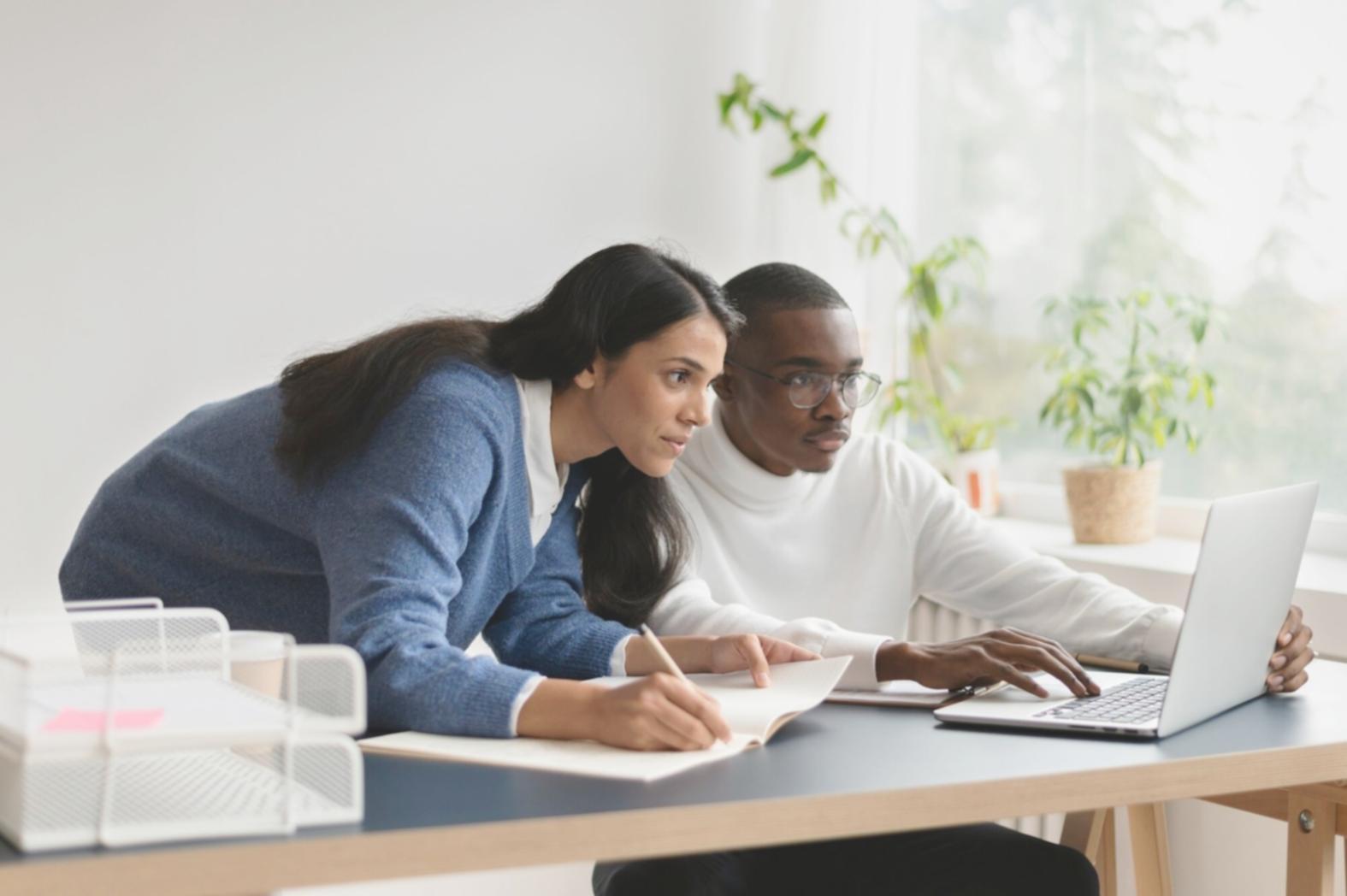 Person reviewing financial stability reports and planning documents
